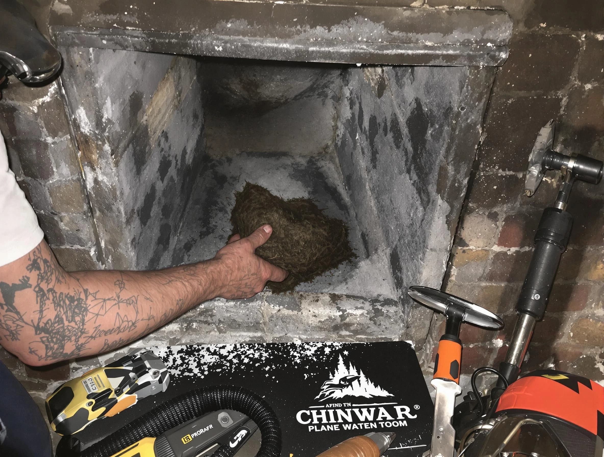 East Basin Chimney Sweep safely removing debris and screening chimney in East Basin, UT